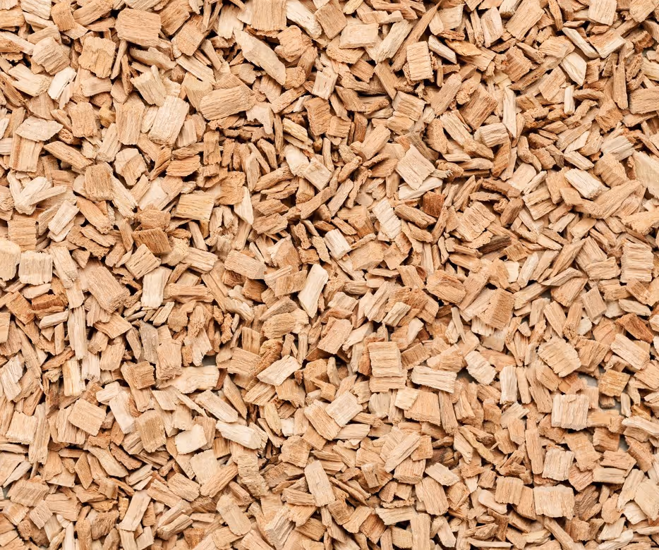 Processed wood chips from timber operations requiring bulk forestry product transport and biomass fuel delivery