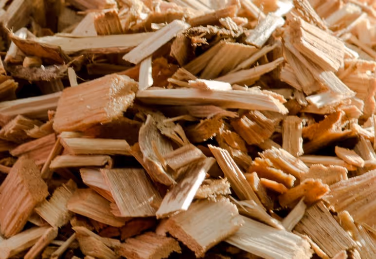 Wood chips and biomass fuel material from forestry operations requiring industrial wood fuel transport and energy delivery