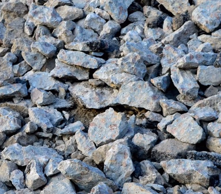 Recycled concrete aggregate (RCA) crushed material for construction requiring recycling material hauling and aggregate transport