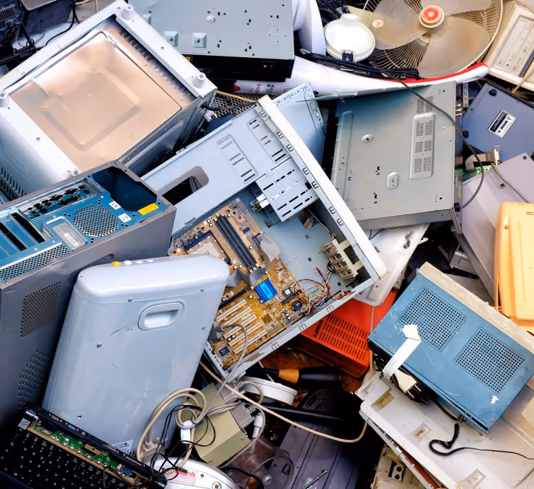 Electronic waste including computers, monitors and circuit boards requiring specialized e-waste recycling material hauling