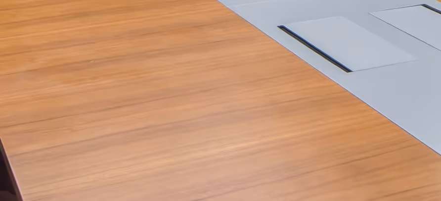 Large wooden conference table and office furniture requiring specialized commercial furniture hauling and office relocation