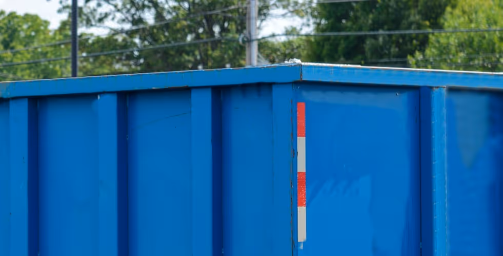 Commercial waste container and dumpster for industrial waste management requiring specialized waste handling equipment hauling