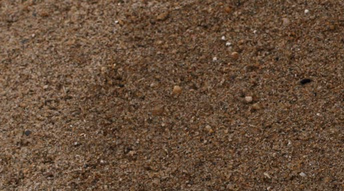 Brown sand granules for extreme cold weather traction and commercial winter safety services