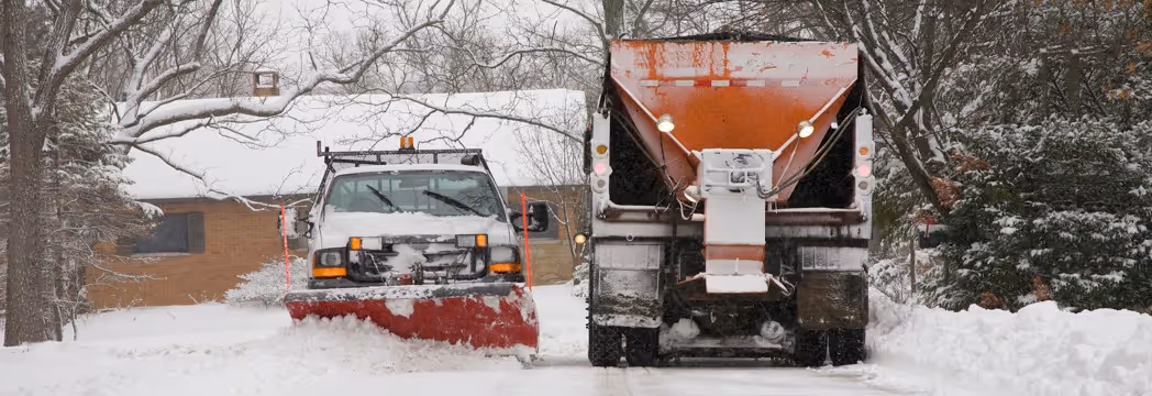 Winter service dump truck with snow plow and salt spreader for commercial snow removal and road maintenance