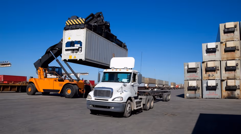 White container chassis truck for intermodal freight transport and commercial shipping container delivery