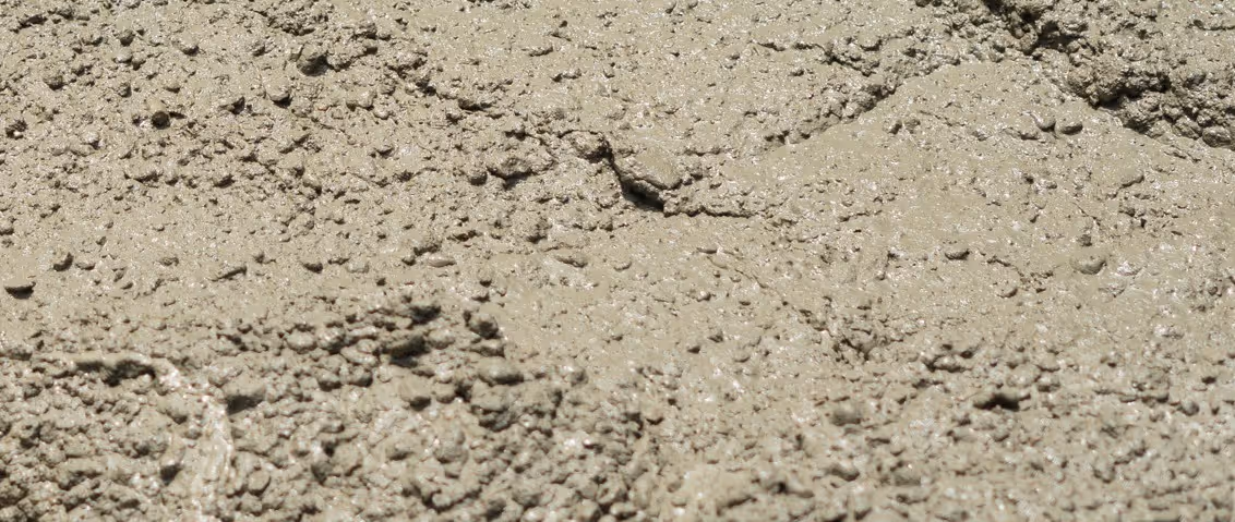 Beige foundation concrete mix for structural concrete hauling and load bearing construction transportation services