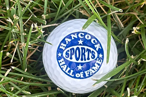 Golf ball with Hancock Sports Hall of Fame logo.