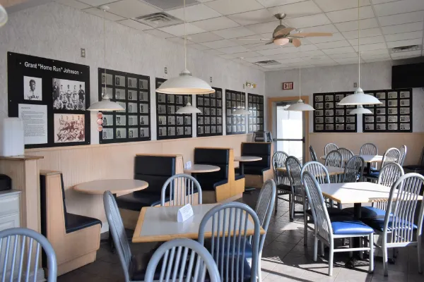 Tony's Restaurant Hancock Sports Hall of Fame memorabilia. Wide shot of seating area.