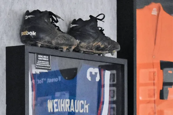 Tony's Restaurant Hancock Sports Hall of Fame memorabilia: Cleats and Blue Jersey.
