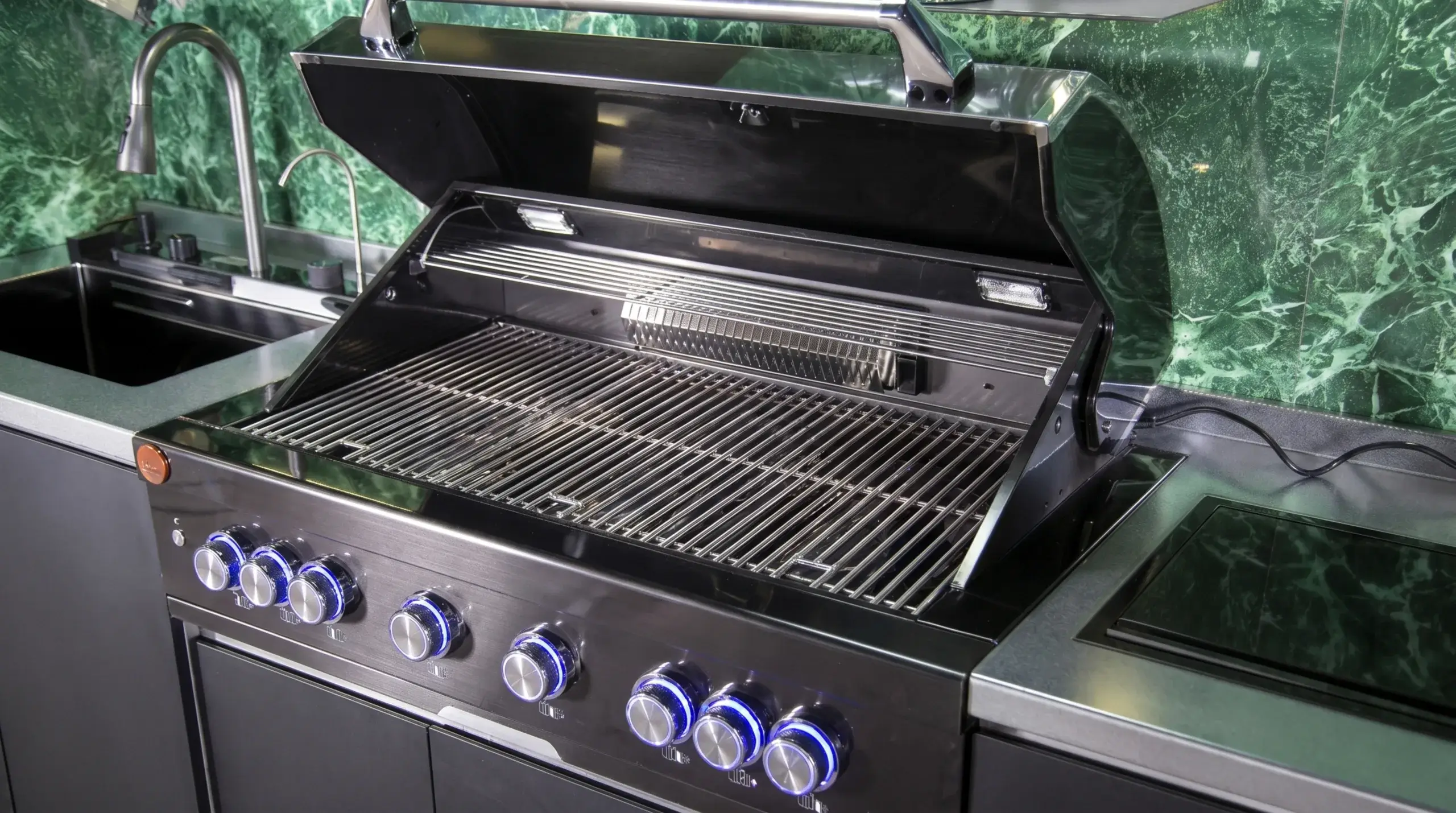 Dual-fuel charcoal and gas grill burner knobs on Desert Shade outdoor kitchen cooking system
