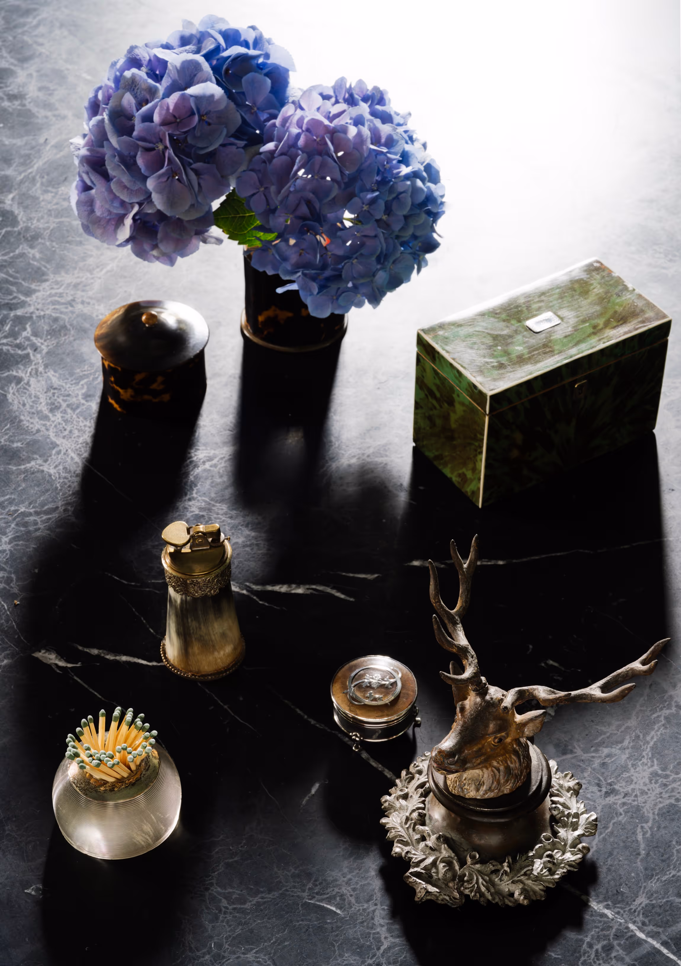Table scape with blue hydrangeas in a vase