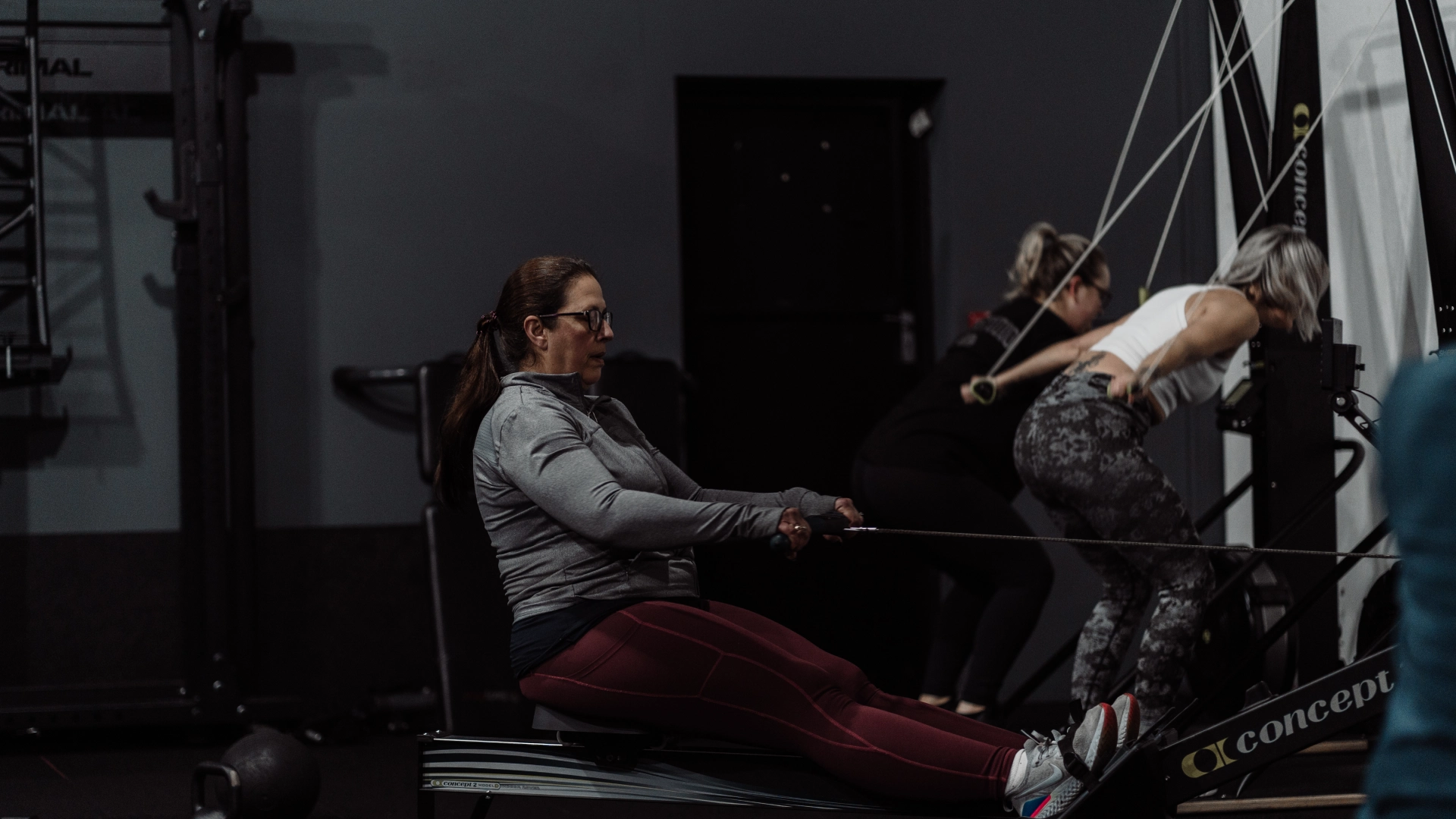 A group of individuals exercising together in a gym at Unity Personal Training in Grays, ENG.