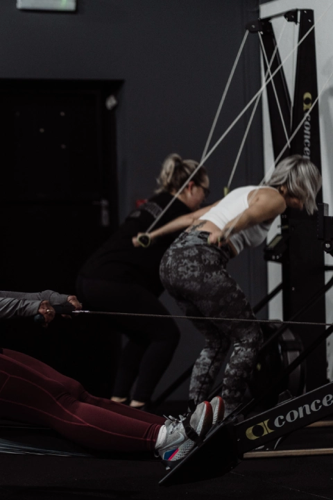 A group of individuals exercising together in a gym at Unity Personal Training in Grays, ENG.