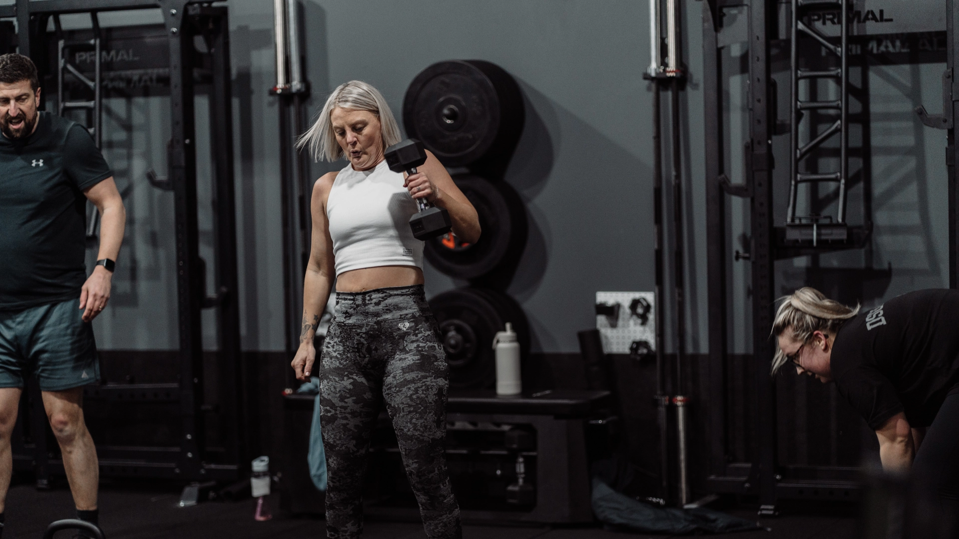 A man and woman exercise together in a gym during a Strength & Conditioning session at Unity Personal Training in Grays, ENG.