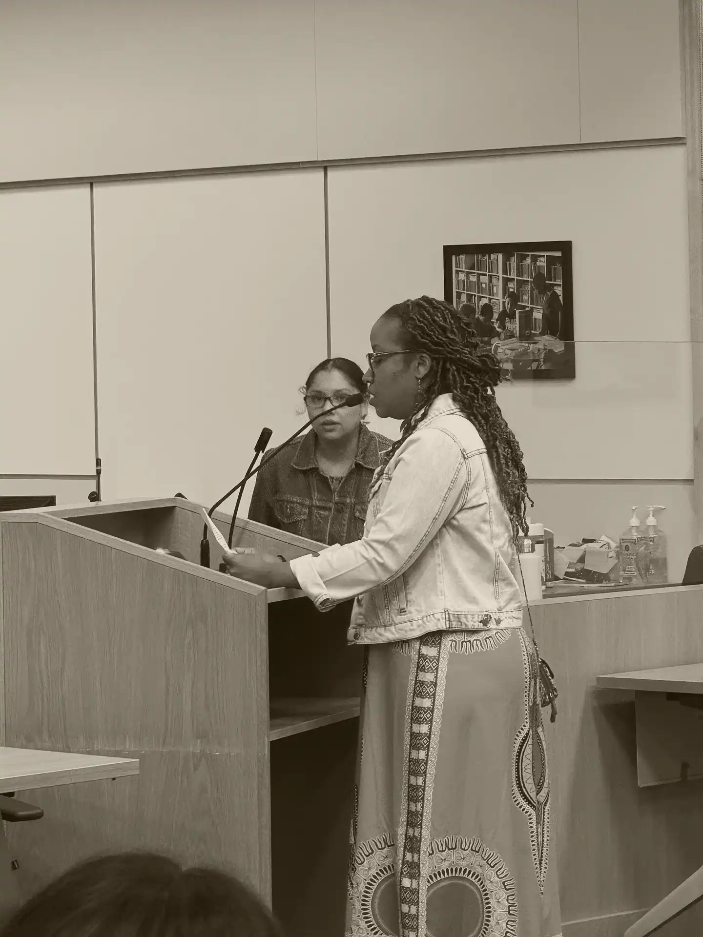 A woman speaks at a community event
