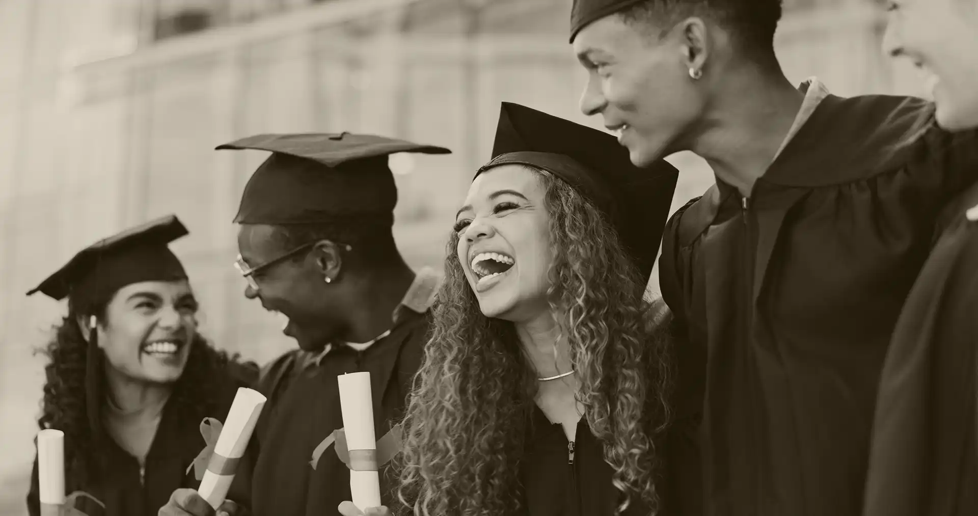 a group of university graduates celebrates their educational success