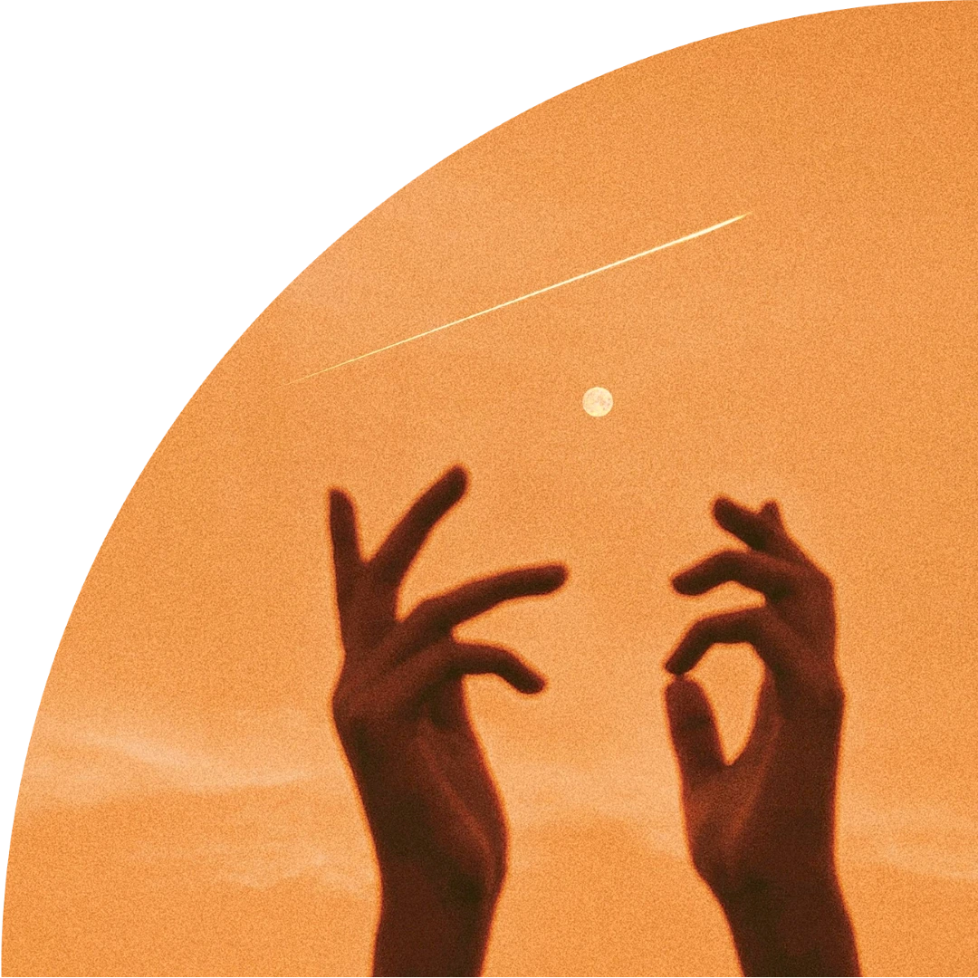 Lori Pereira Image Two Hands in front of a sky with a moon