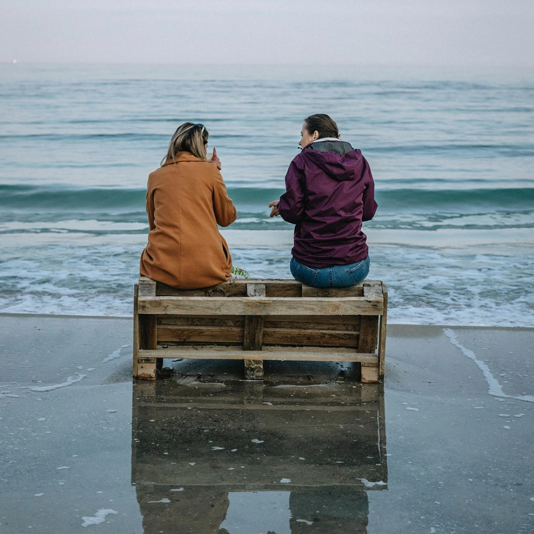 Lori Pereira Image Two People Sitting by the sea