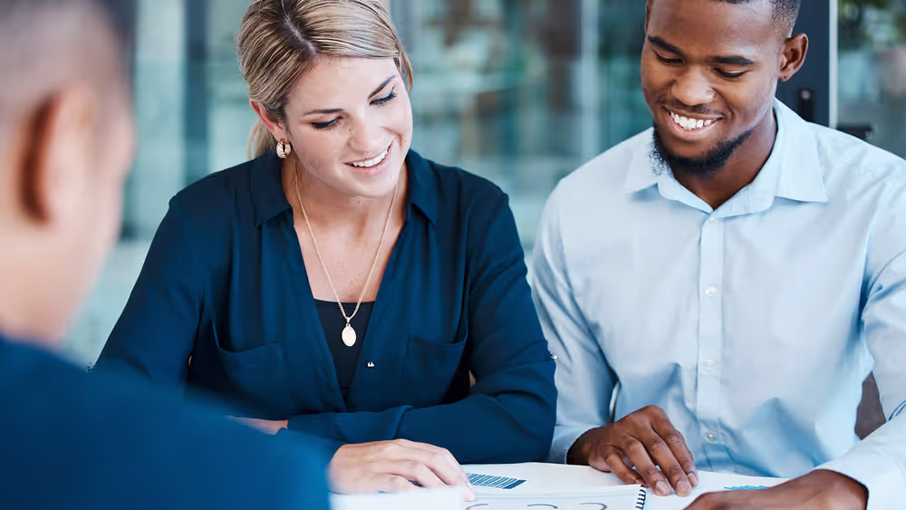 Happy couple looking at documents