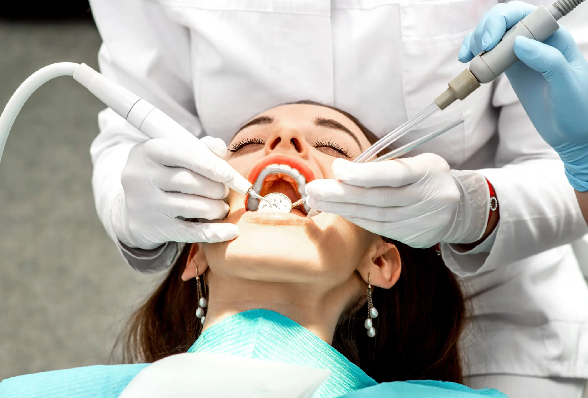 Dental hygienist performing teeth cleaning in Columbia.