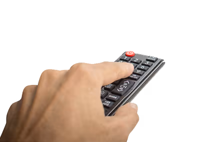 A hand holding a remote control with various buttons, including a prominent red power button, against a white background.