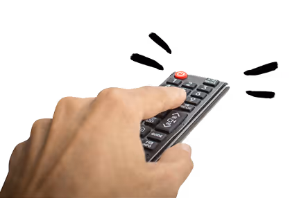 A close-up of a hand pressing a button on a remote control, with the remote featuring several buttons including a red power button.