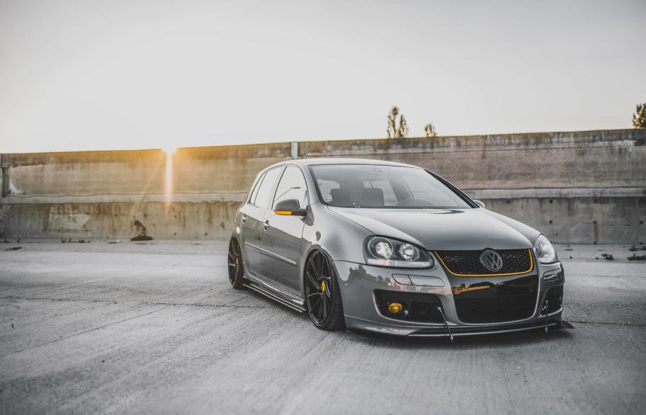 Grey car in the sunset