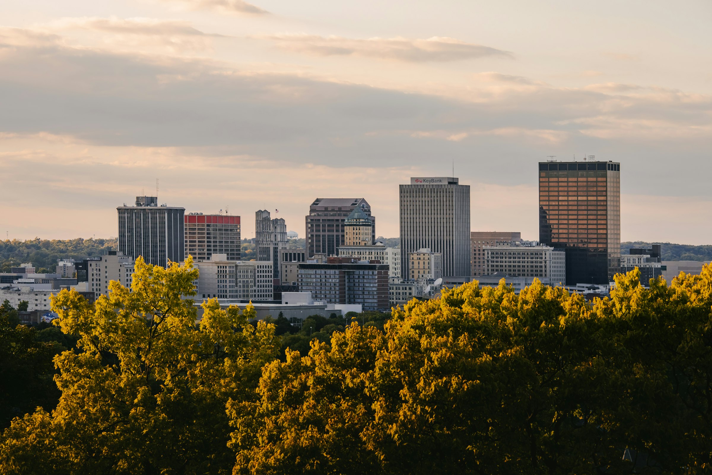 Downtown Dayton, Ohio skyline framed by trees from Woodland Cemetery