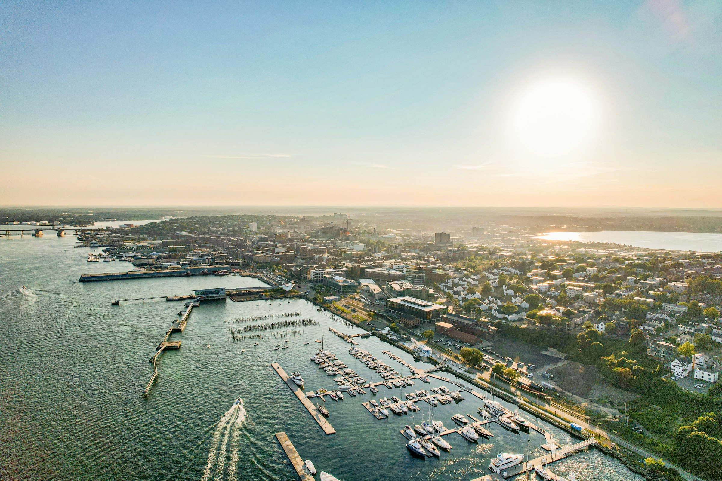 Aerial view of the Portland, Maine waterfront and marina at sunrise