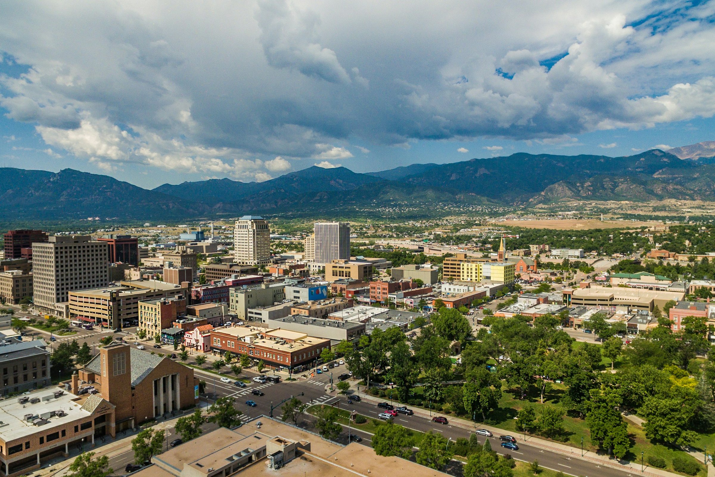 Aerial view of downtown Colorado Springs, Colorado with the Rocky Mountains beyond