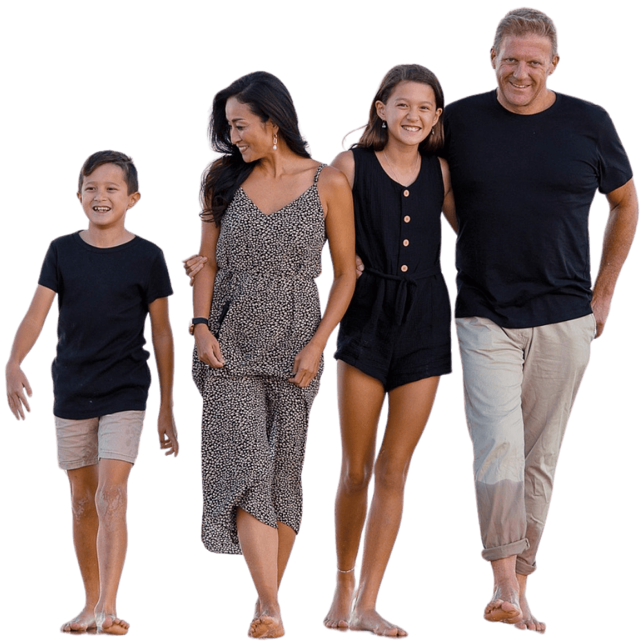 Family of 4 taking a walk and smiling. 