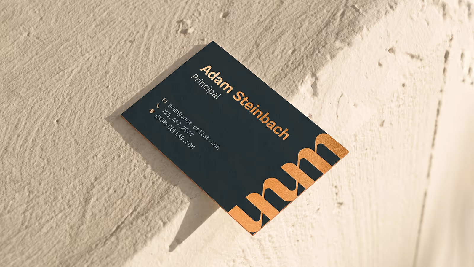 Mockup of a business card showing UNUM's branding