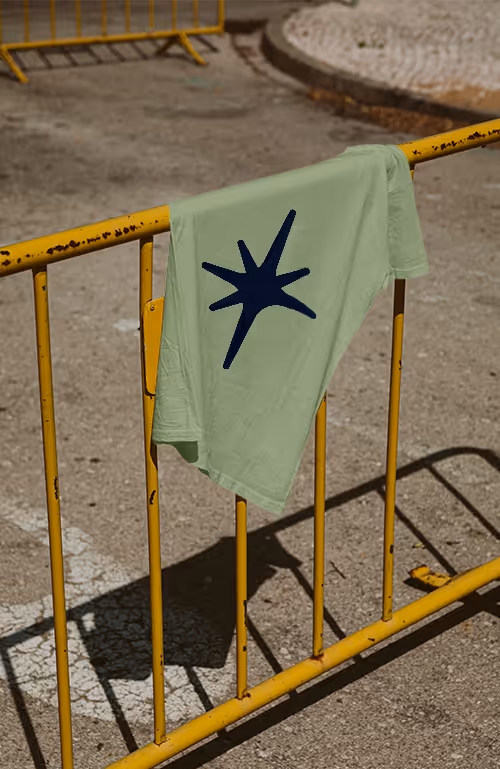 Mockup of a Tshirt showing Energy Shift Method's branding and emblem