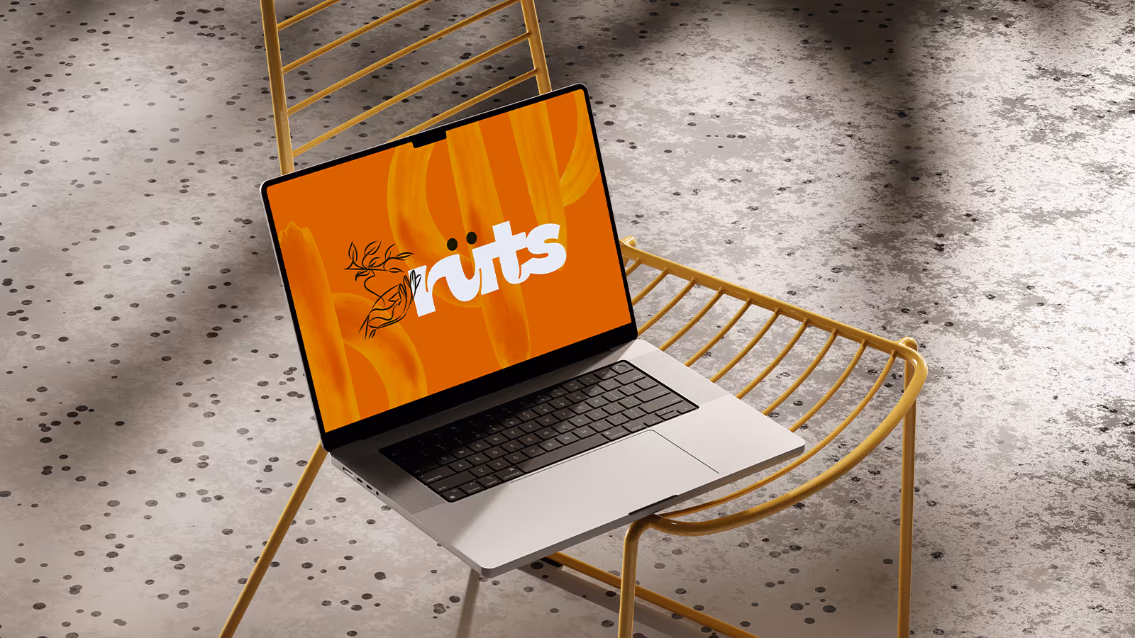 Mockup of a laptop on a chair with Ruts' logo on the screen on an orange background