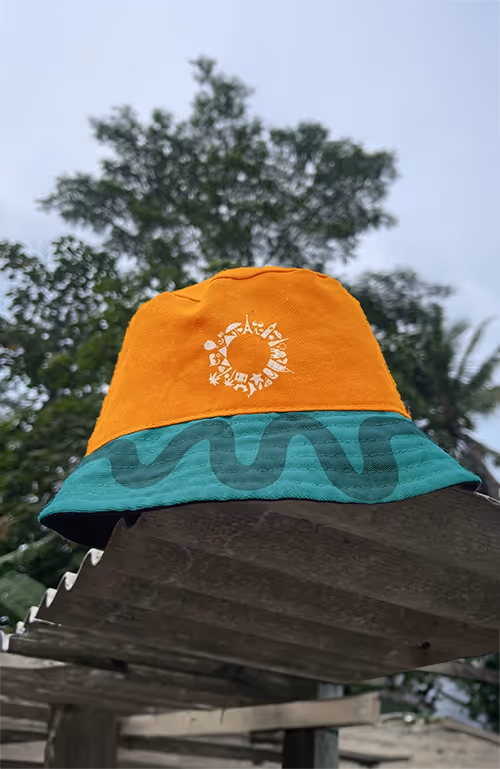 Mockup of a bucket hat with Experience Makers Tourism's logo on it