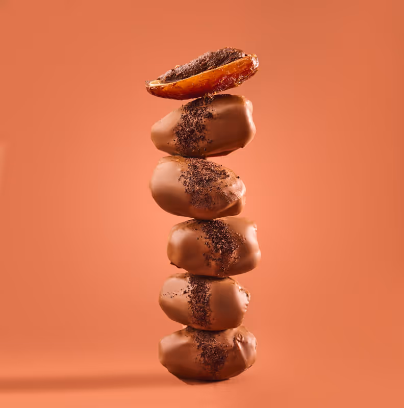 An artistic photo of six dates stacked on top of eachother