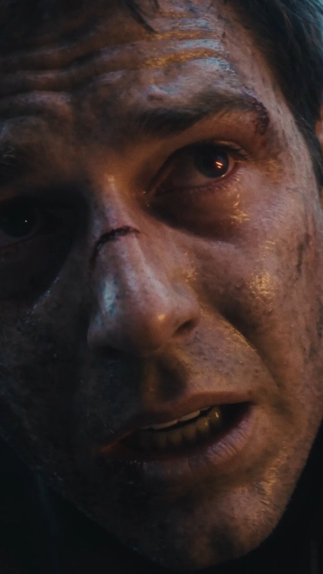 Scarred face in close-up at dusk