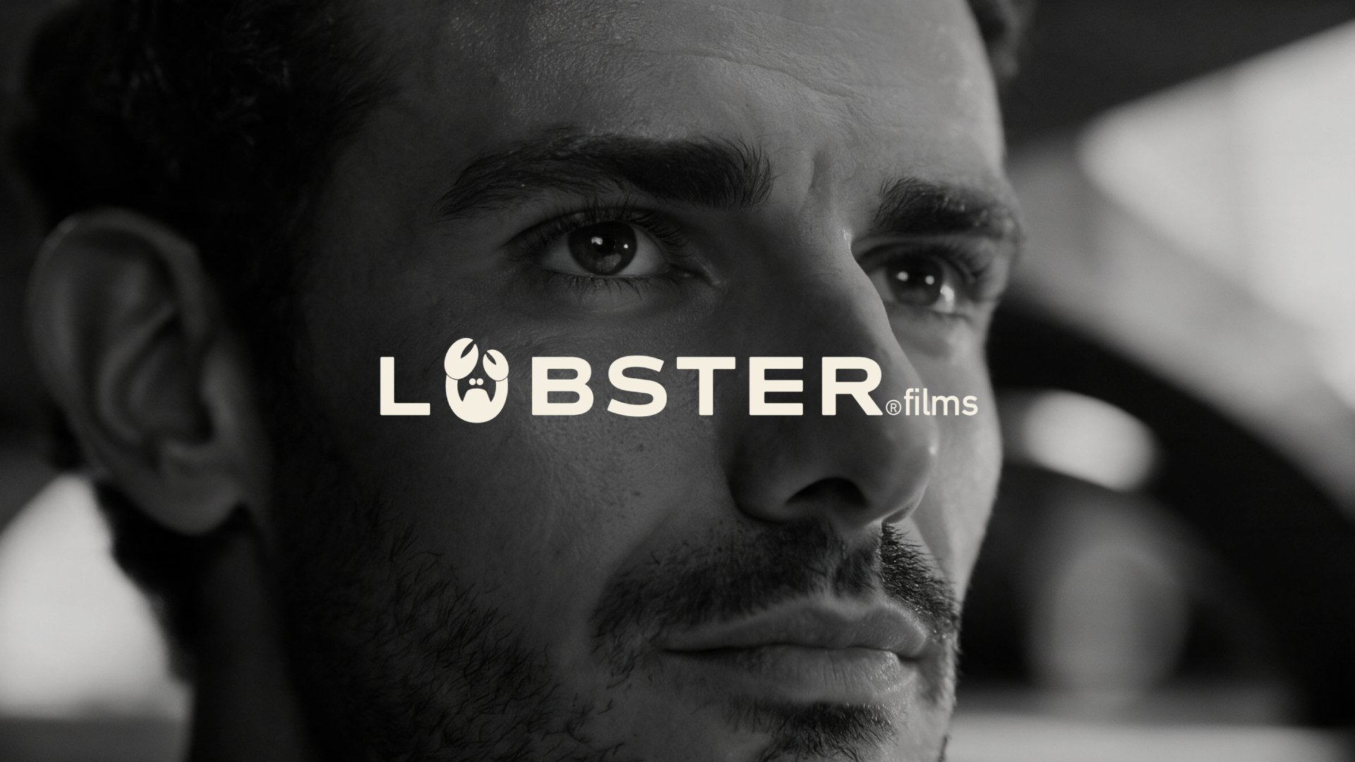 Que Gardens campaign, black and white close-up of the lead with the Lobster Films logo