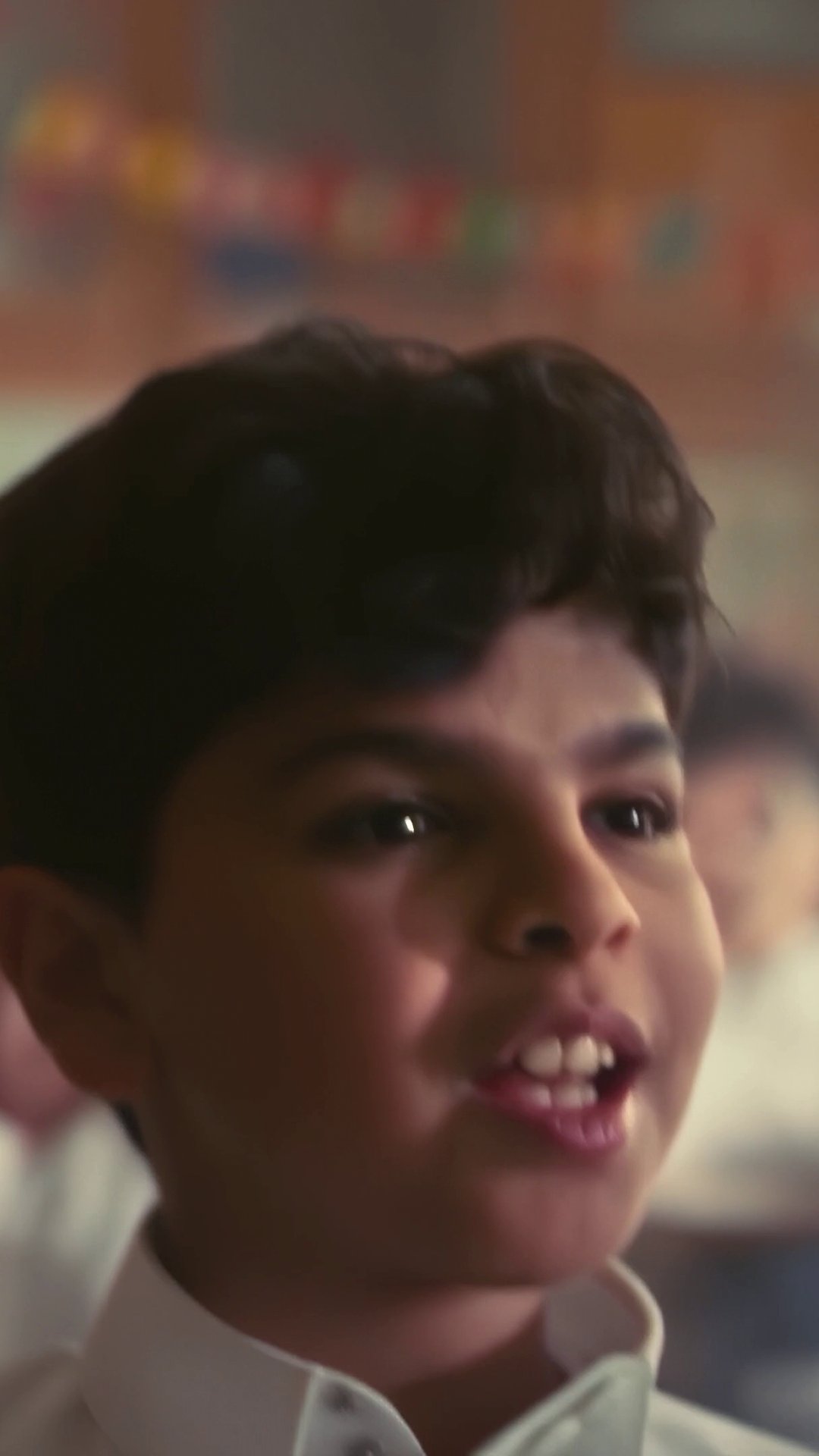 Student smiling in the classroom