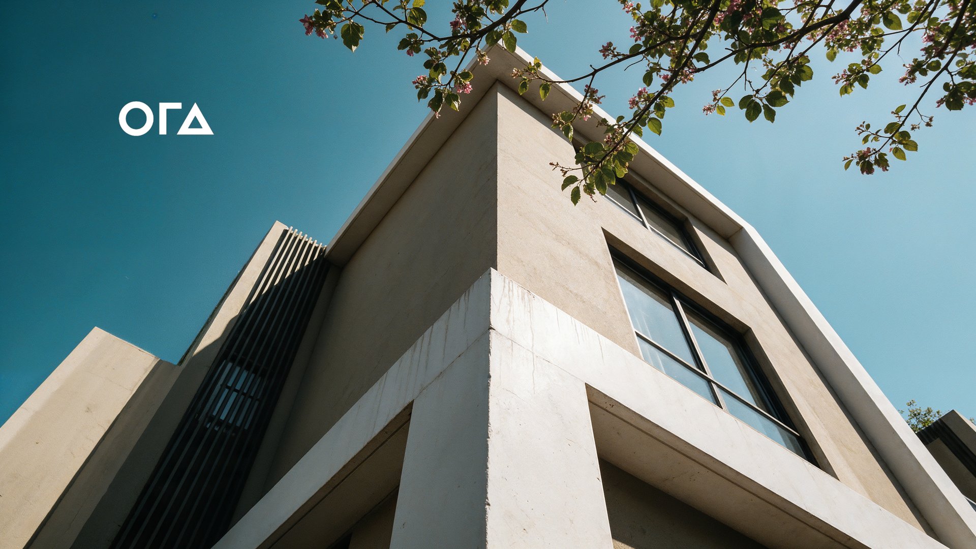 Al Waha Plus villa facade against a blue sky with the ORA logo