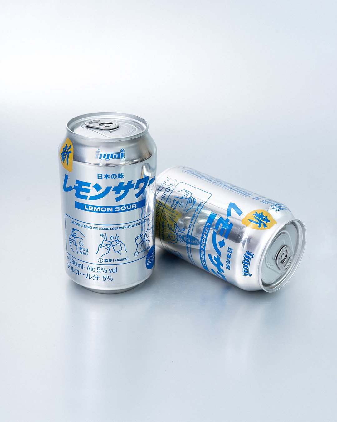 Two Lemon Sour cans, one standing and one lying down