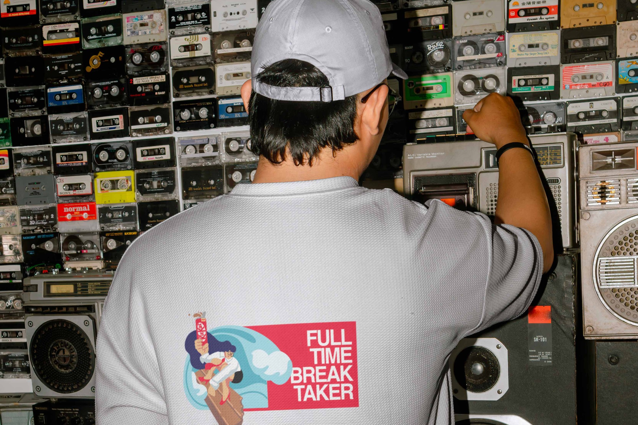 Full Time Break Taker tee print in front of a cassette wall