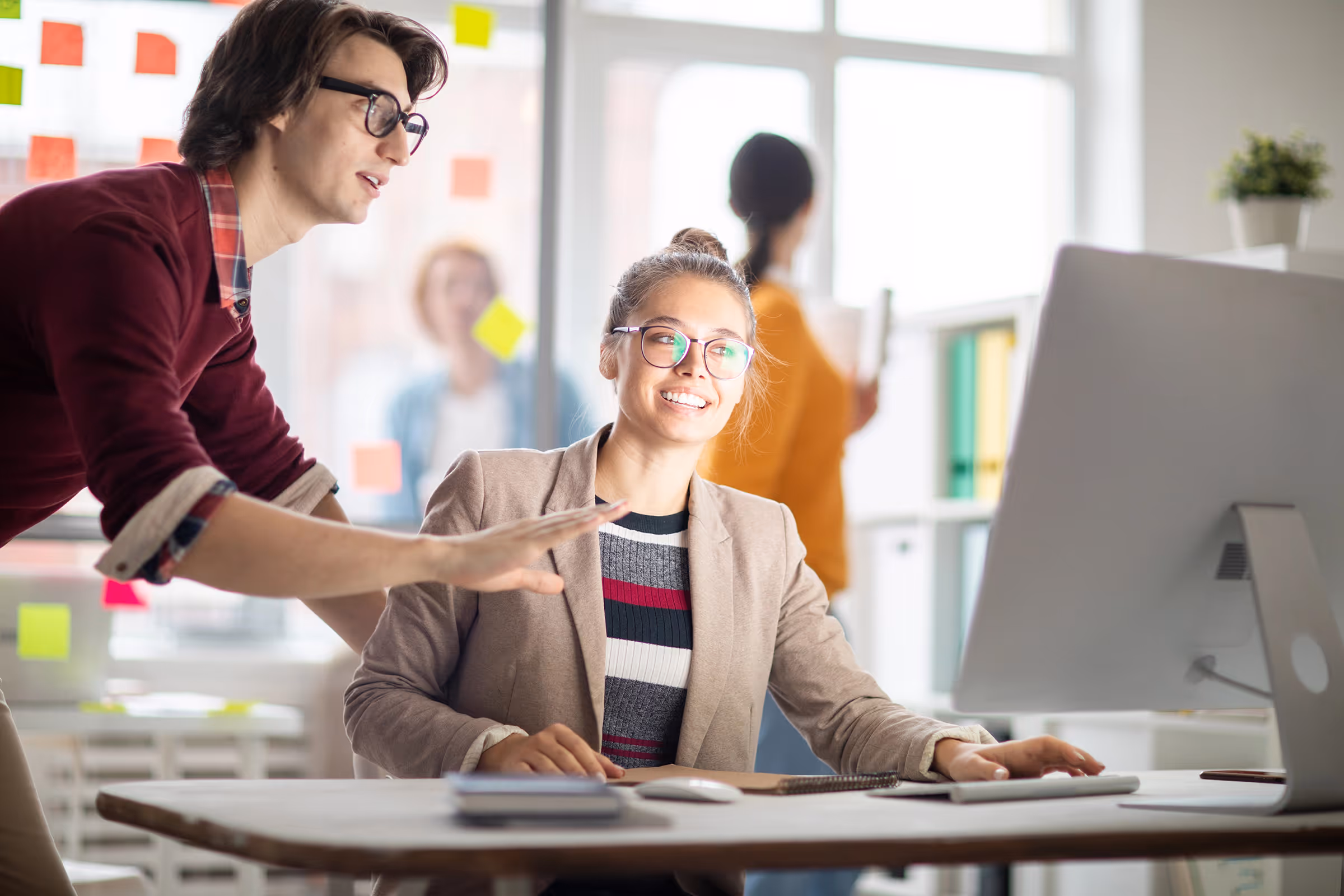 Young tech professionals working together.