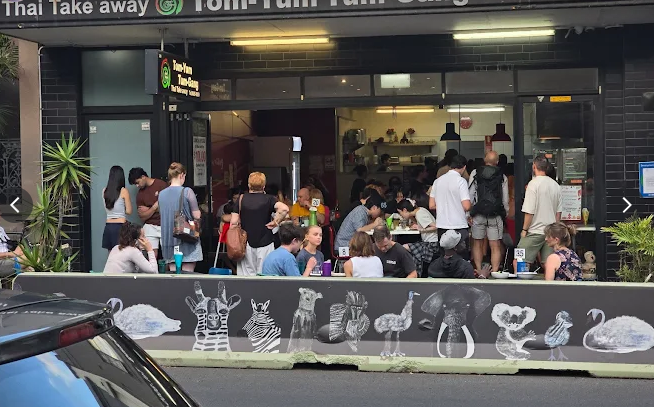 Tom Yum Tum Gang Thai restaurant storefront on Glebe Point Road with busy dining area visible through window