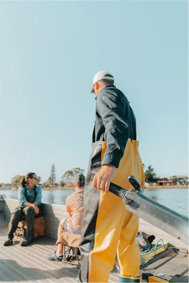 A tour guide driving the boat