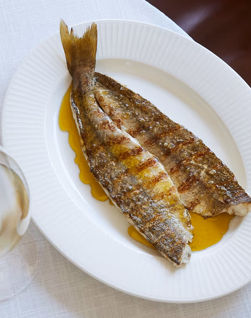 Freshly cooked fish on a white plate