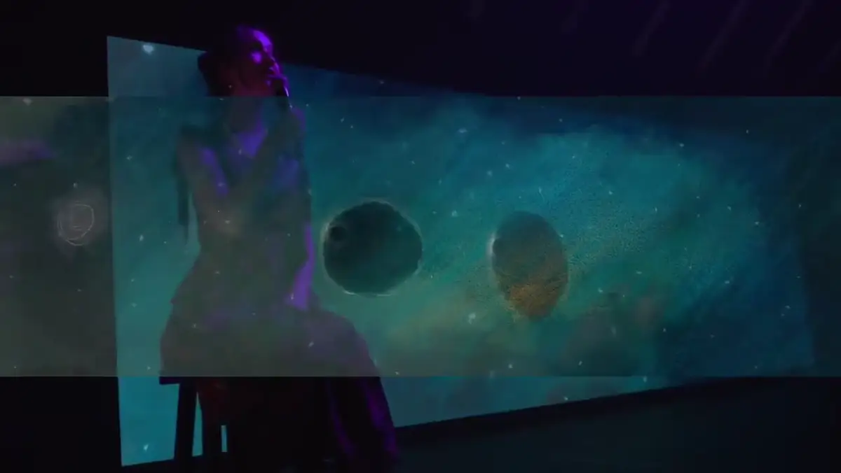 Client-supplied footage of the animation playing behind a live performer