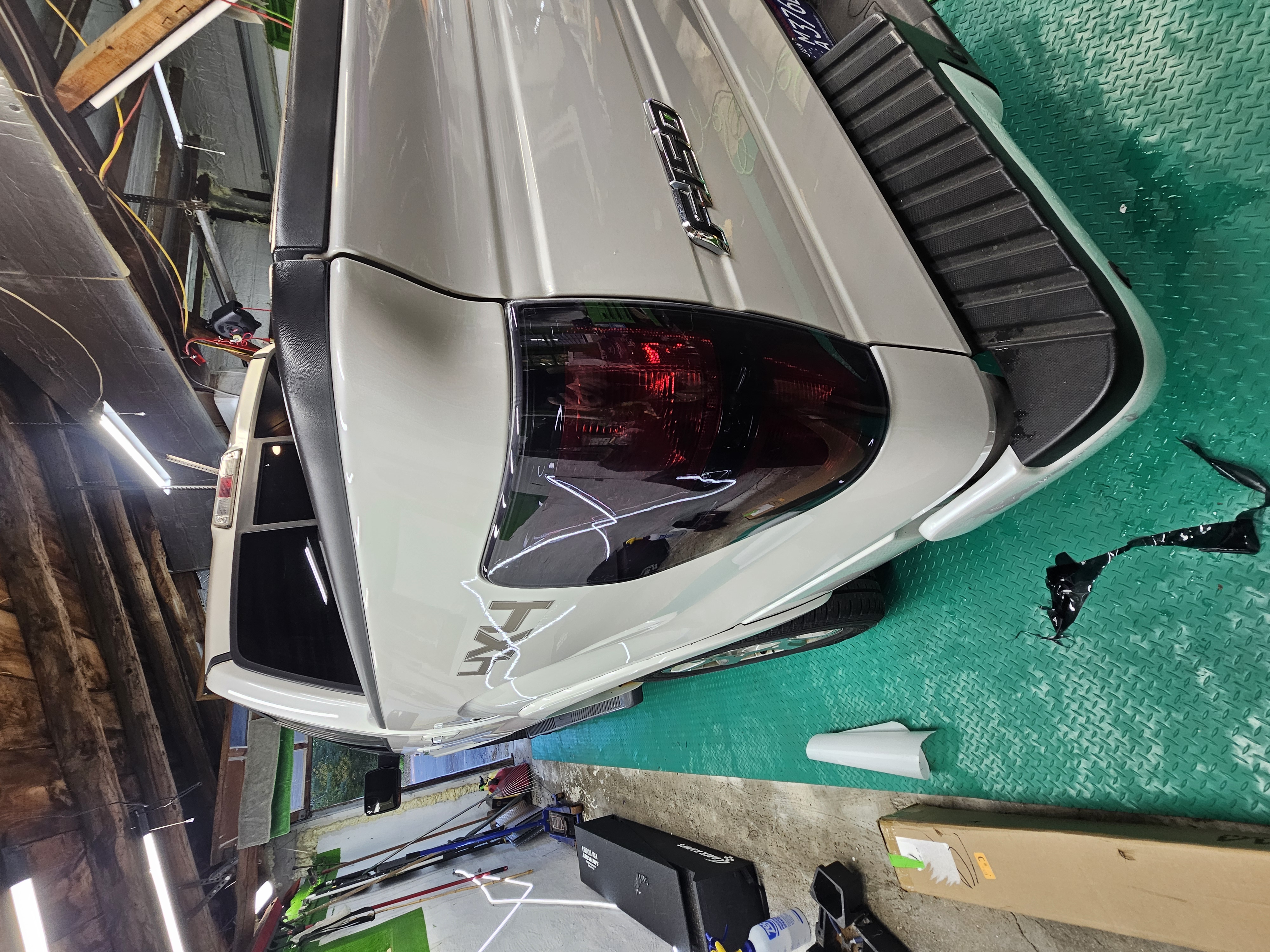 image of mechanics at work on a car