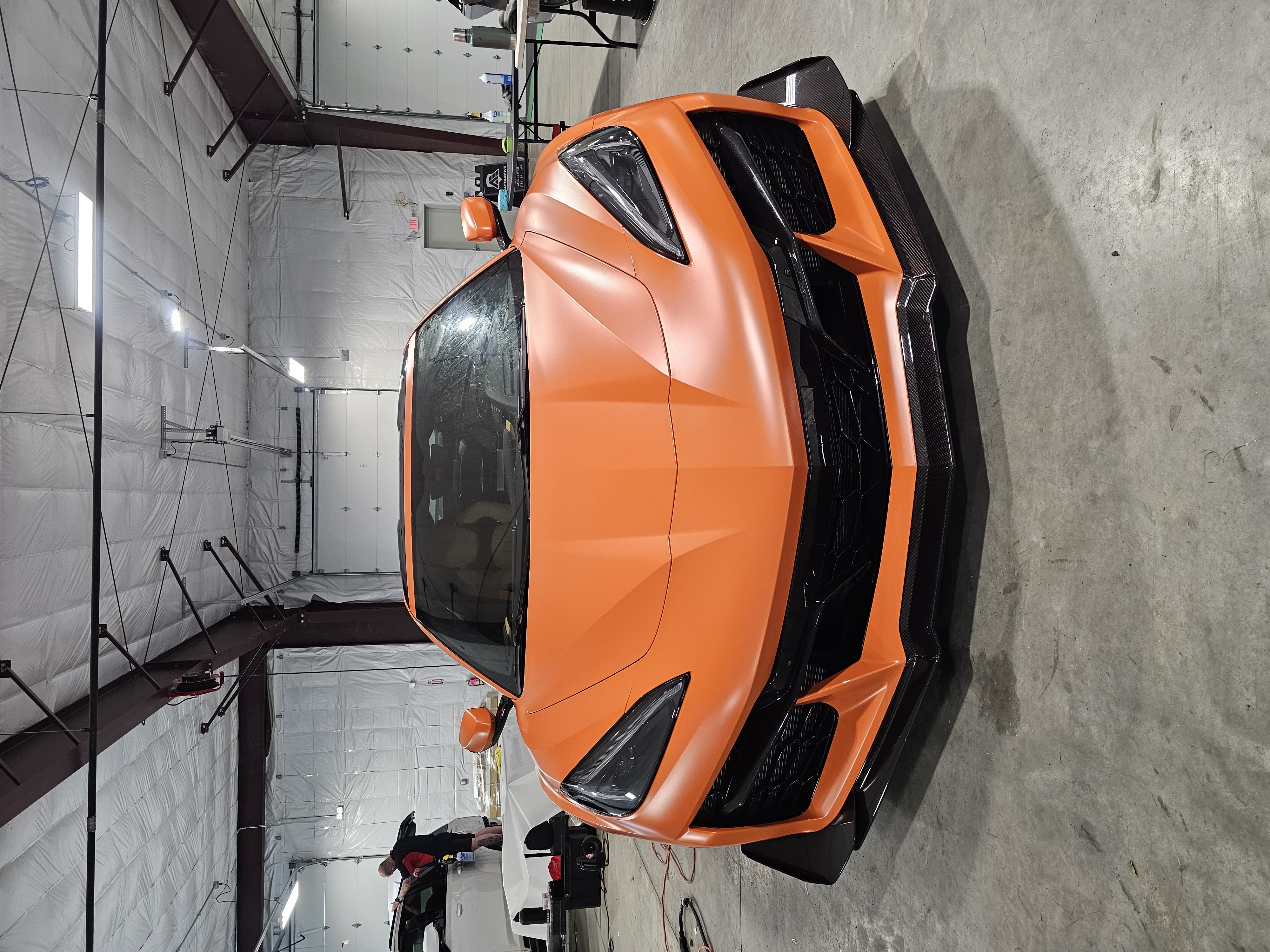 image of mechanics at work on a car