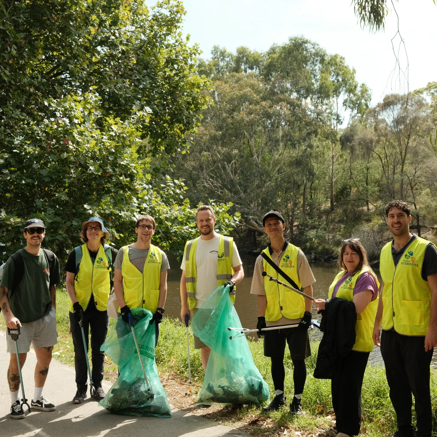 Nomad Coffee Group team volunteering for a sustainability clean-up event in native bushland, showcasing corporate environmental responsibility.